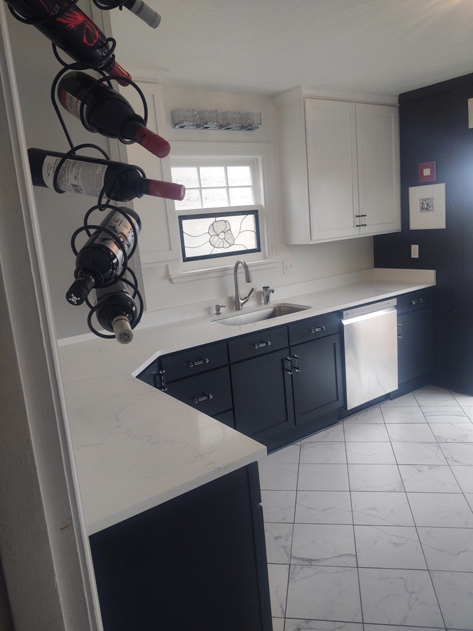 Remodeled Kitchen with cultured stone countertops and tile floors