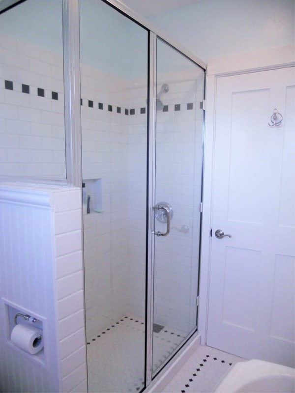 New tile shower stall with glass door